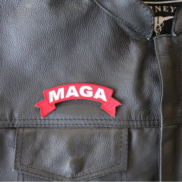 Red MAGA patch on a black leather jacket
